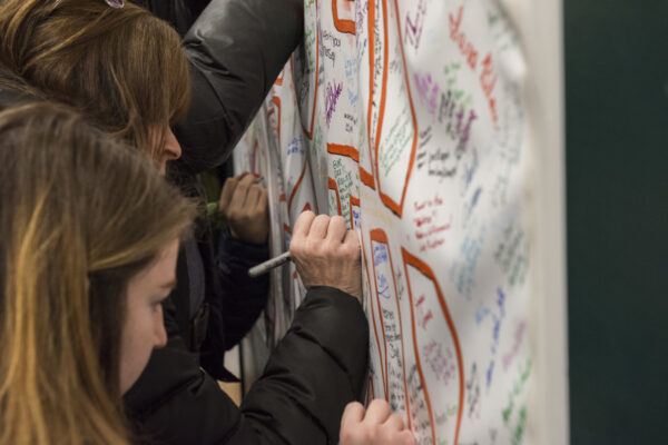 An intimate moment for each of the people who wrote on the poster.