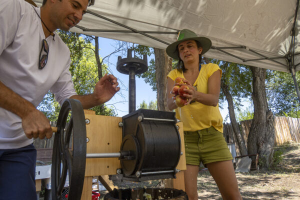 Carmella, Jane's niece, making freshly squeezed apple juice.