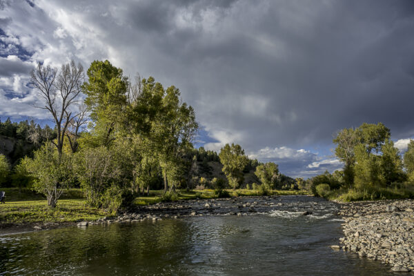 Dramatic sky with the San Juan River in front of our cabin at Fireside Cabins